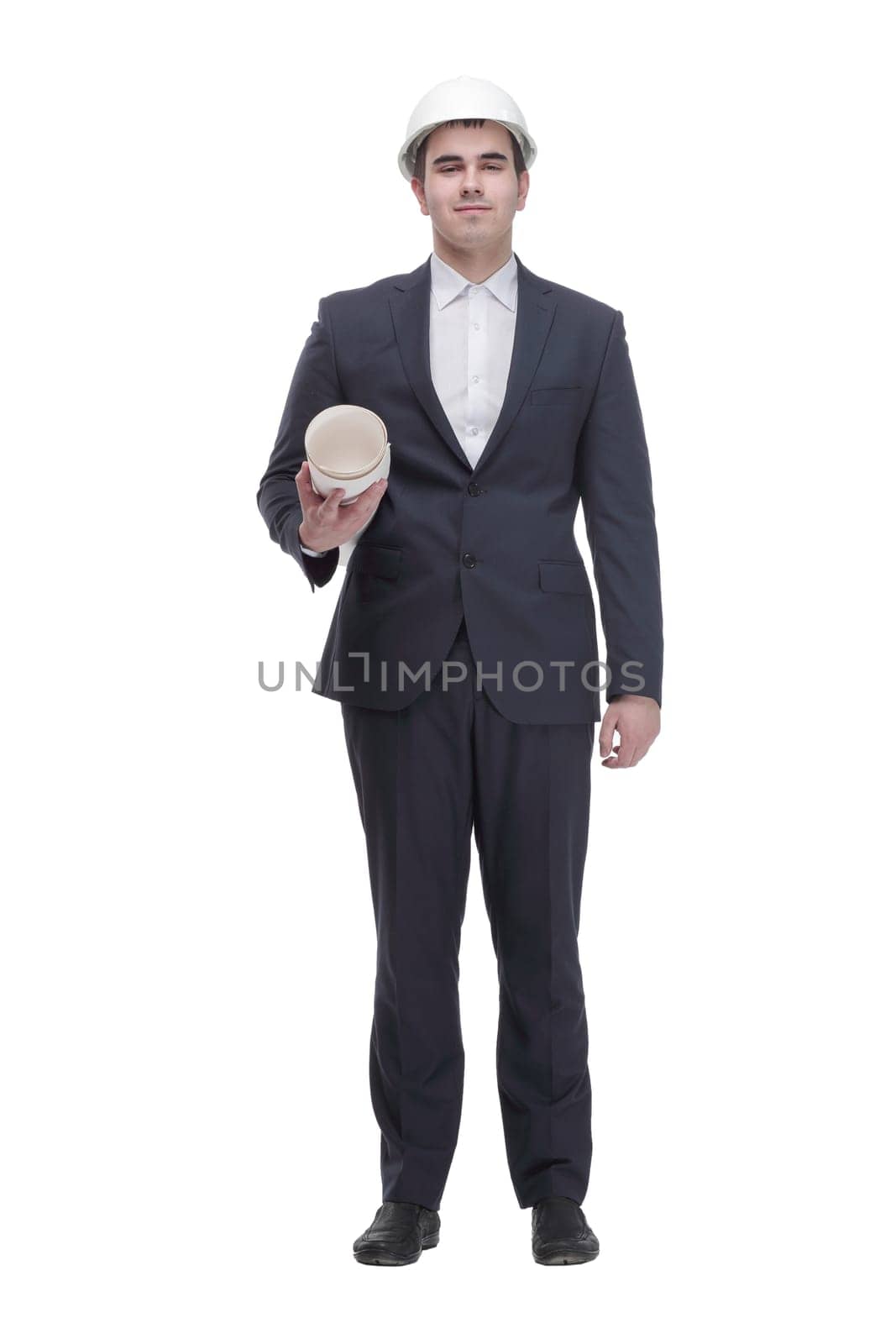 picture of a young business man wearing black suit walking forward - side view