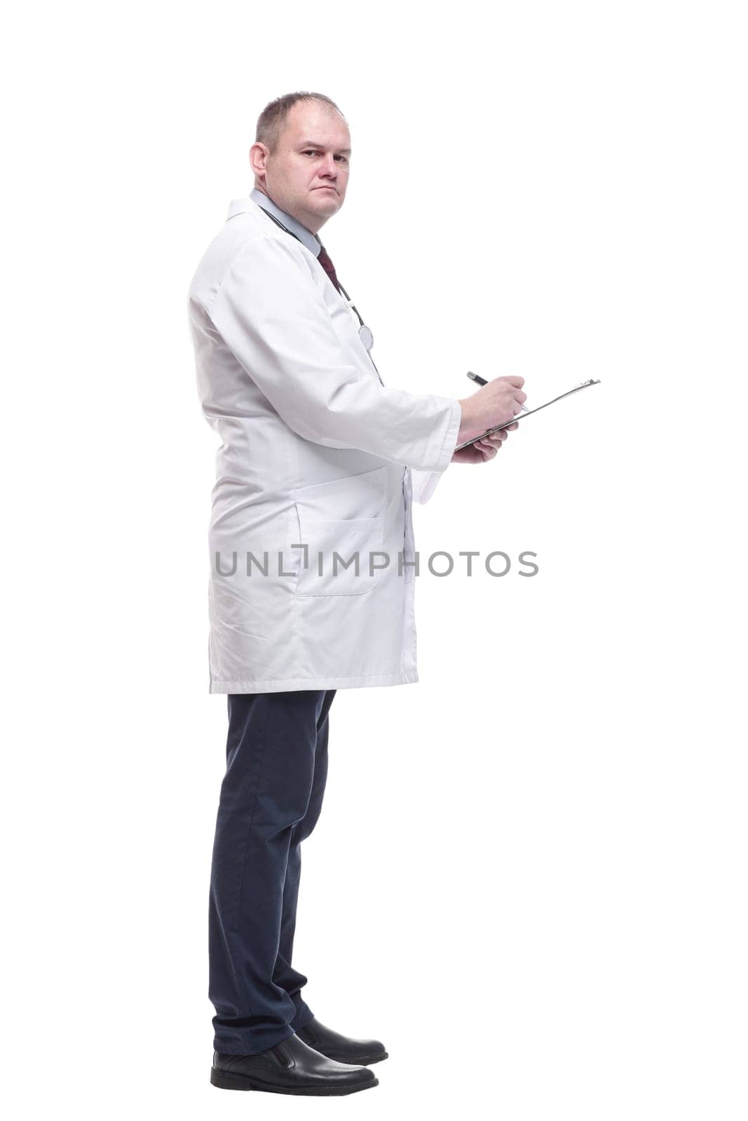 in full growth.qualified doctor with clipboard . isolated on a white background.