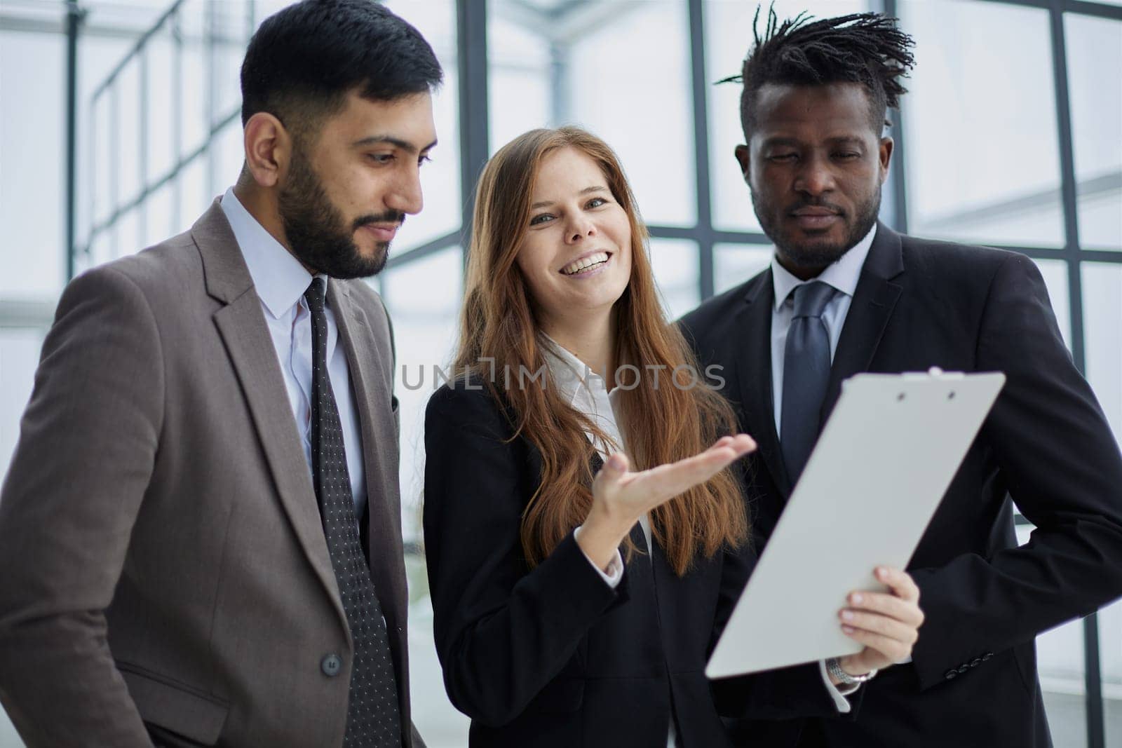 Young businesspeople working together at office corridor,