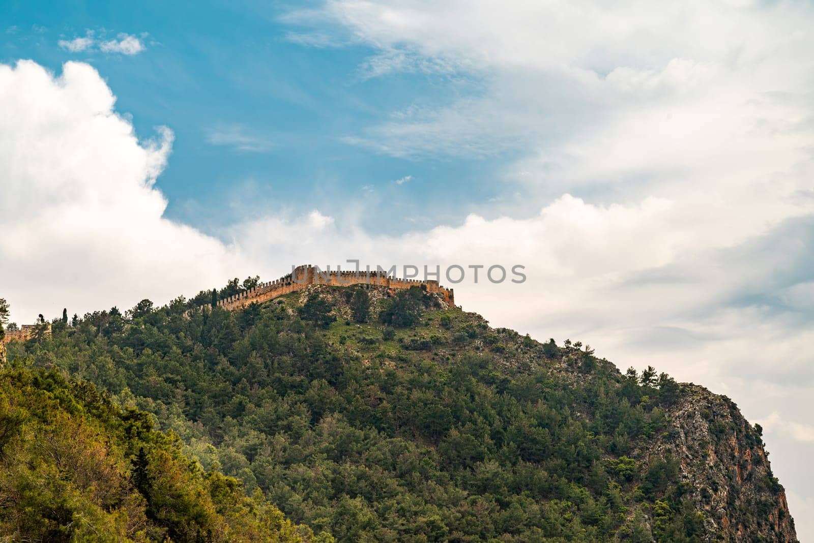 View of Alanya castle from Cleopatra beach on a sunny day by Sonat