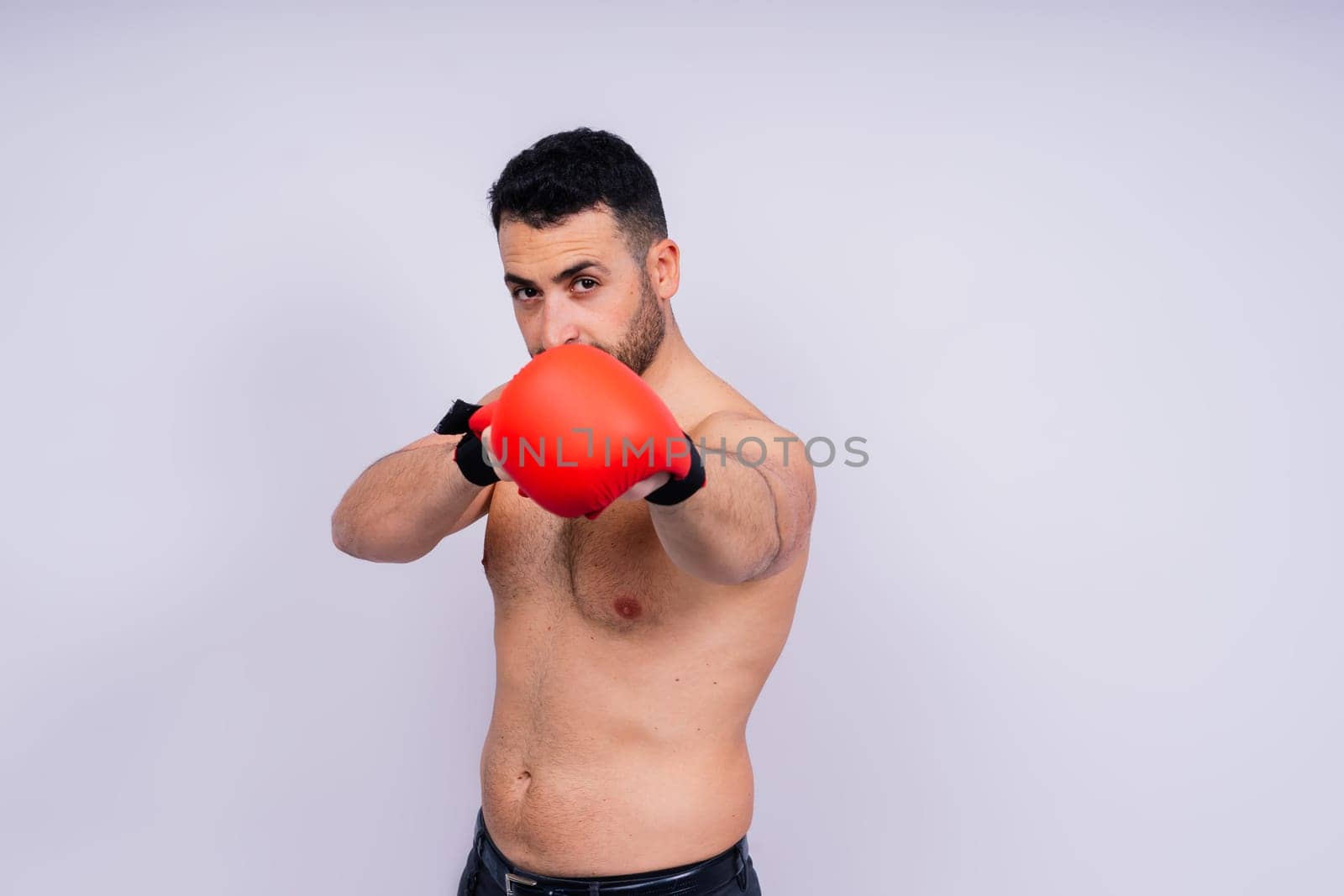 Young caucasian handsome man isolated on white background with boxing gloves by Zelenin