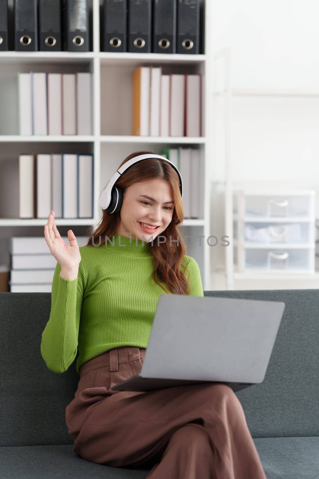 Attractive Asian woman resting comfortable living room and using laptop computer, Relax, Sofa, Lifestyle.