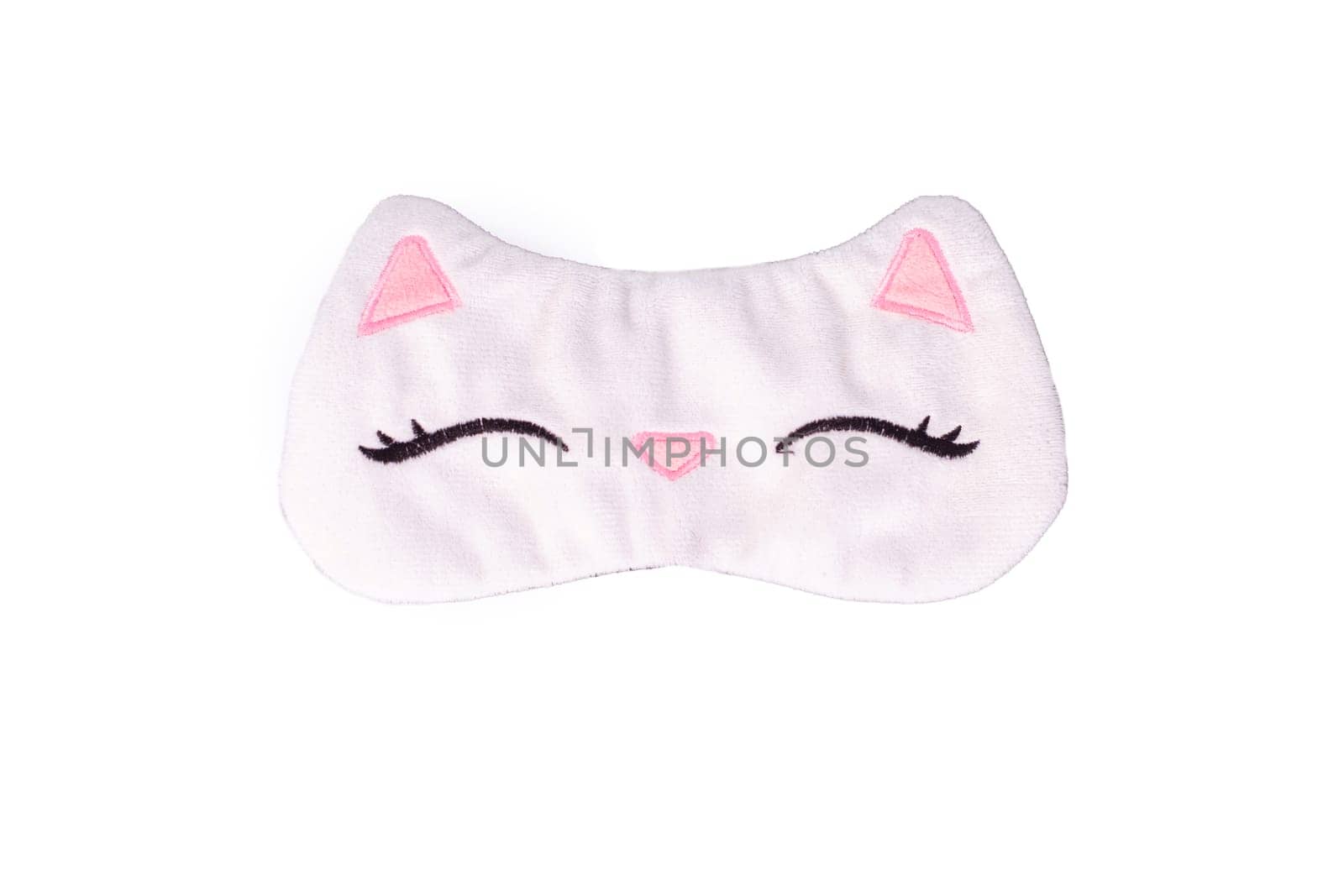White sleep mask in the form of a cat's muzzle, isolated, on a white background. Close up