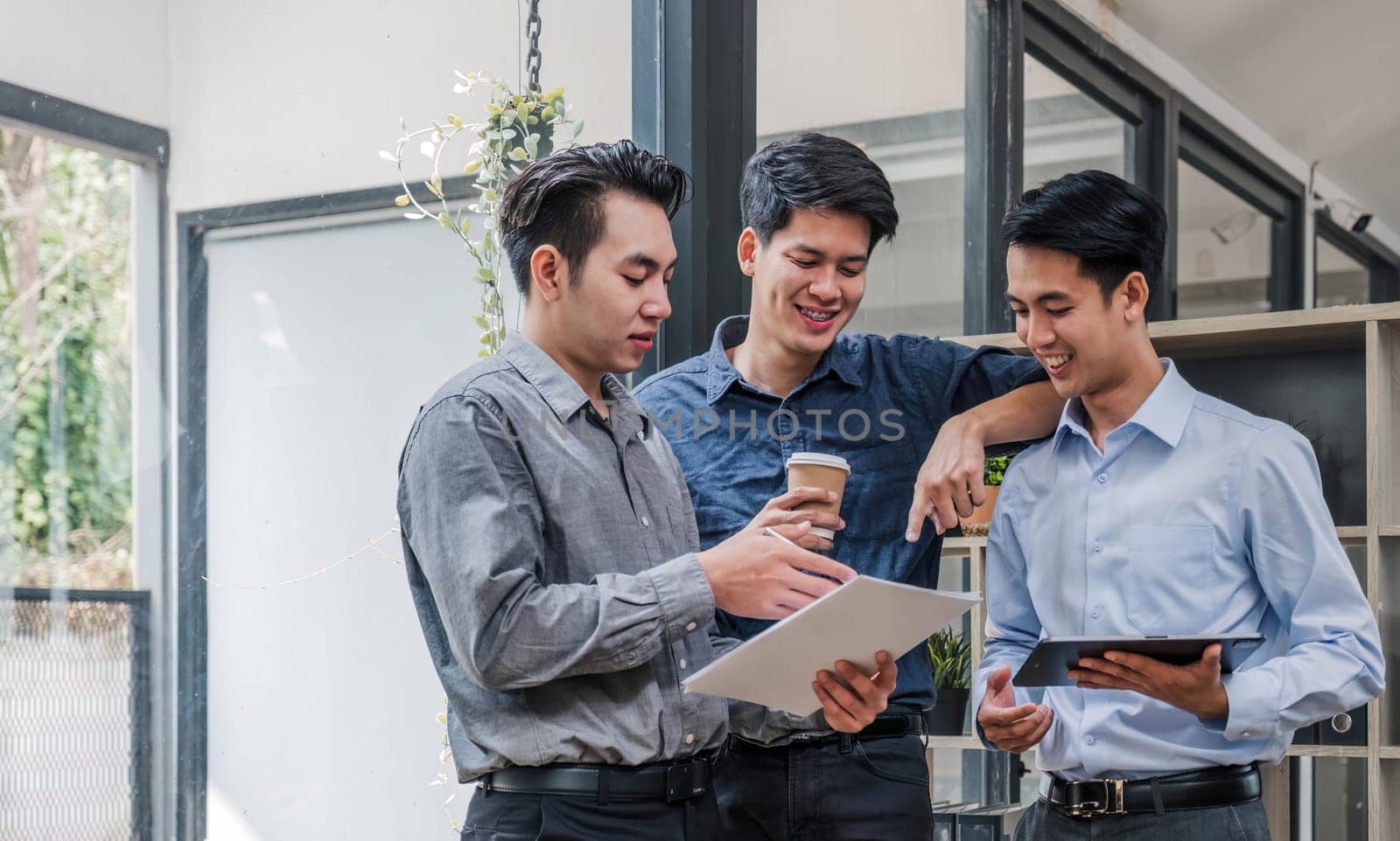 Business People Meeting using laptop computer,calculator,notebook,stock market chart paper for analysis Plans to improve quality next month. Conference Discussion Corporate Concept