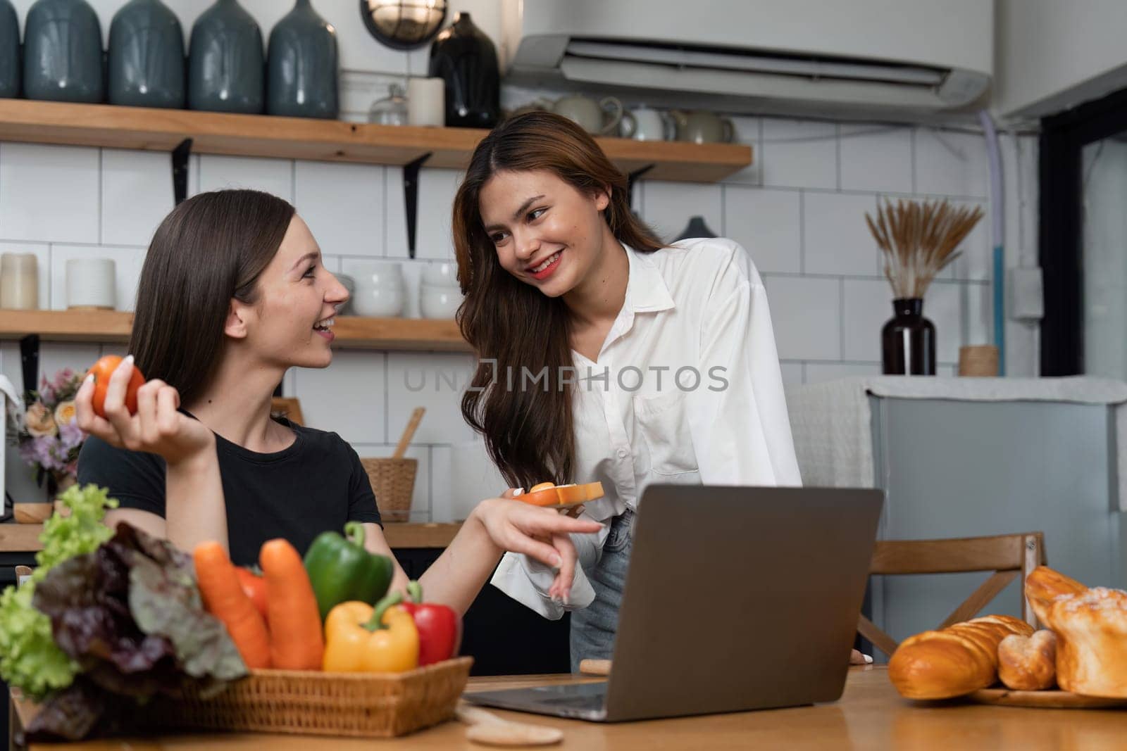 girl chef helping each other to cook healthy food of salad from tasty organic vegetable by learning recipe