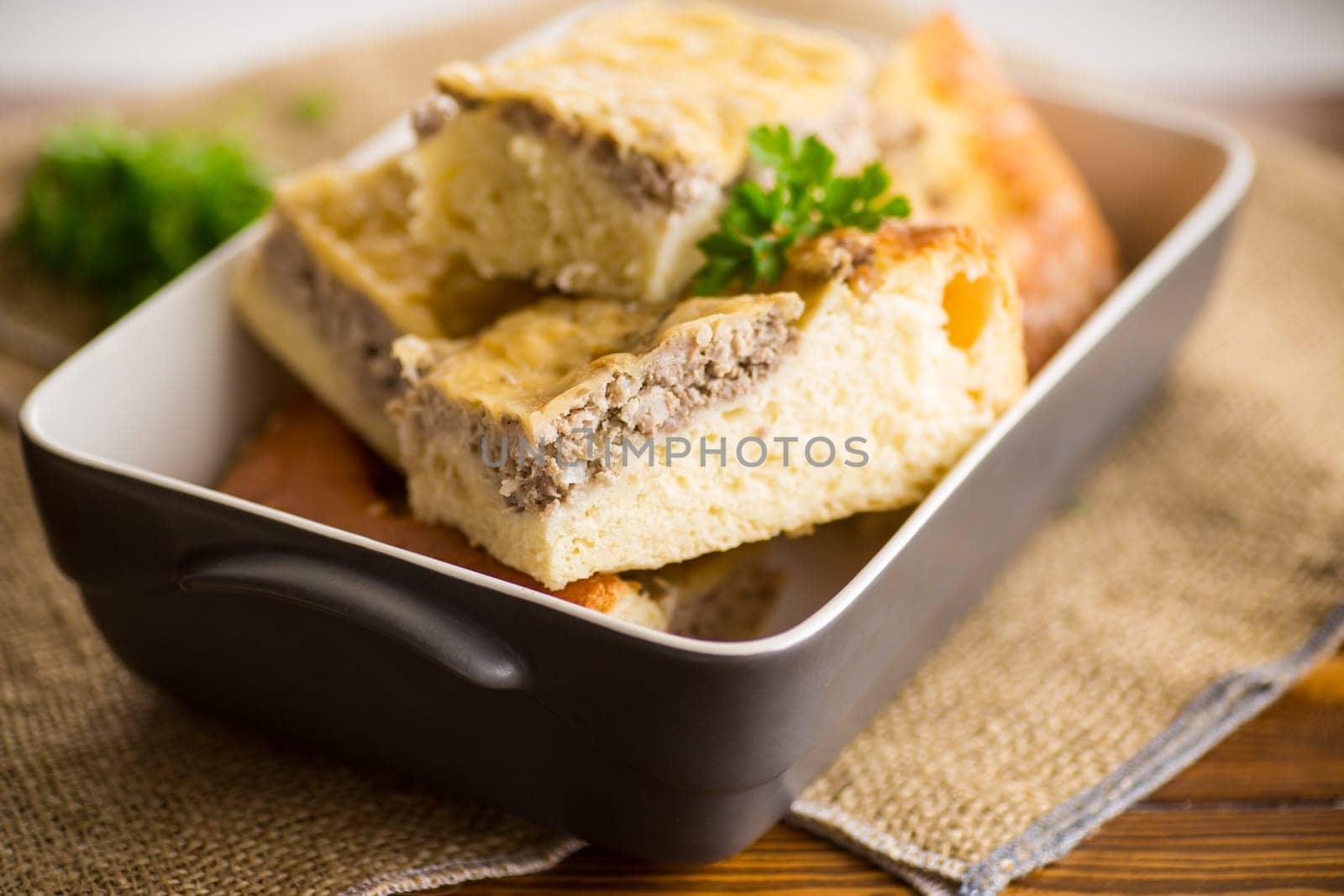 Cooked meat pie, pieces in a plate by Rawlik