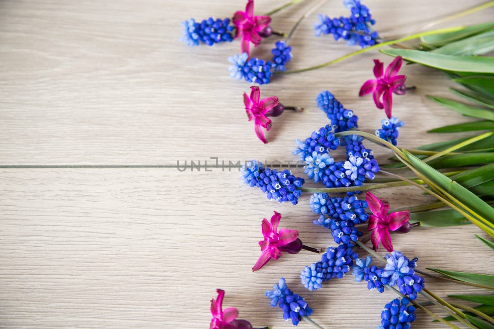 beautiful bouquet of spring flowers on a wooden table, rustic style.