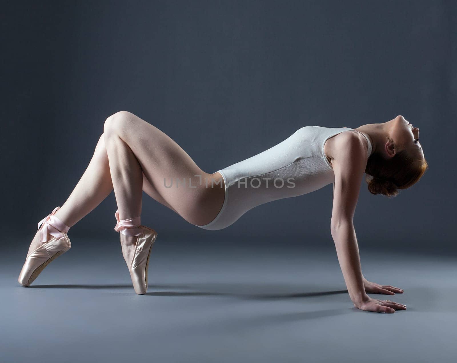 Portrait of emotional graceful dancer on pointes, close-up