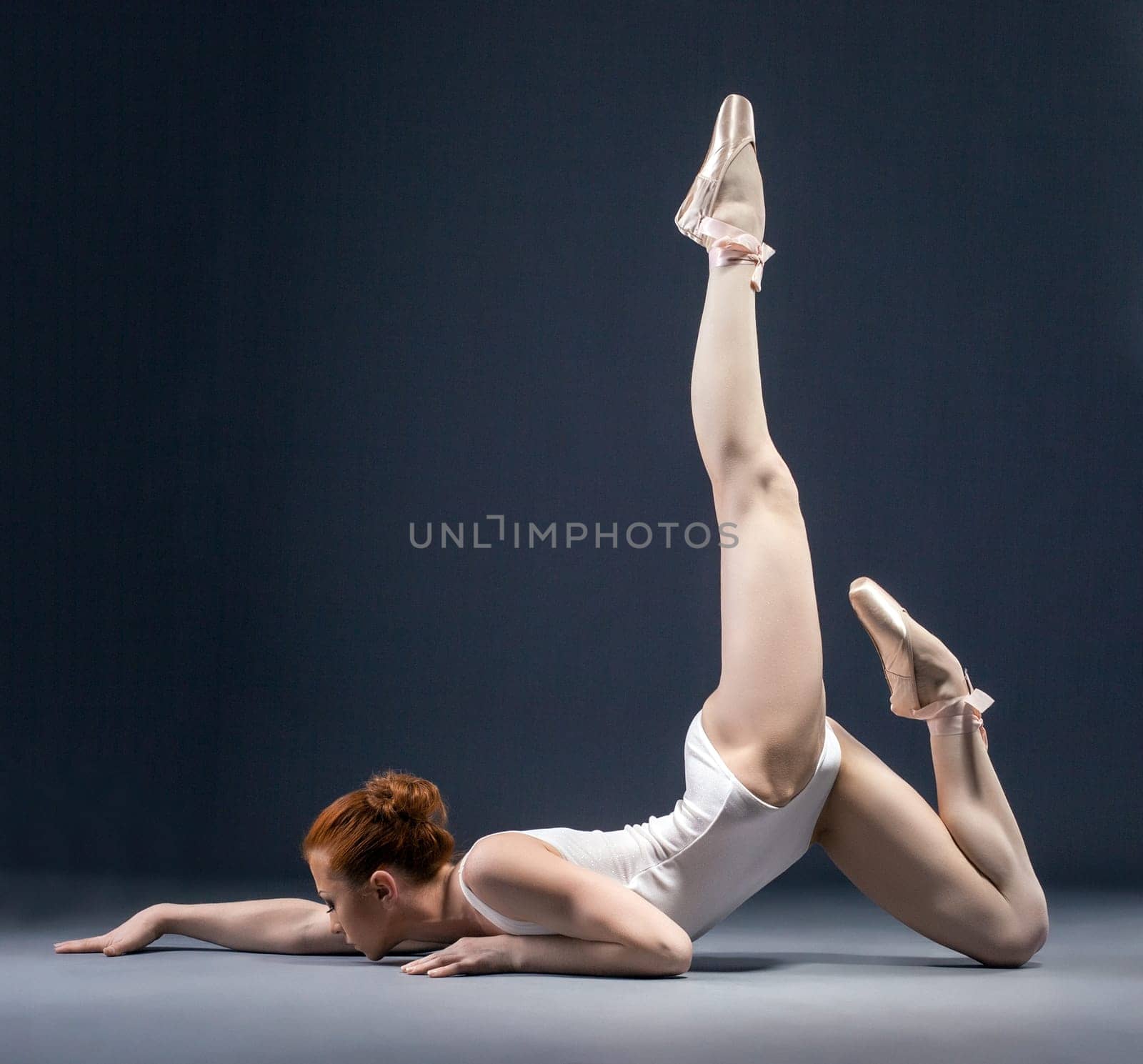 Image of flexible ballerina dancing in studio, close-up