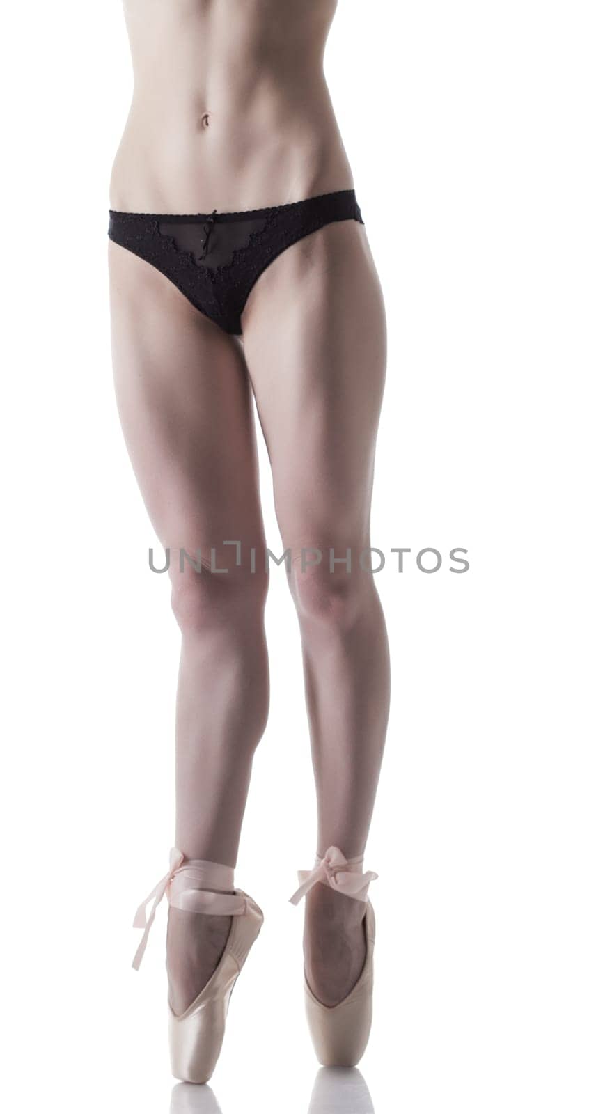 Legs of skinny ballerina, isolated on white background
