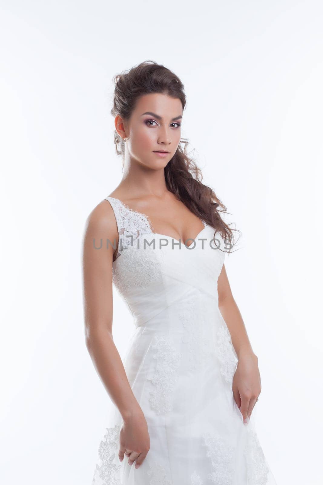 Portrait of charming young bride isolated on white, close-up