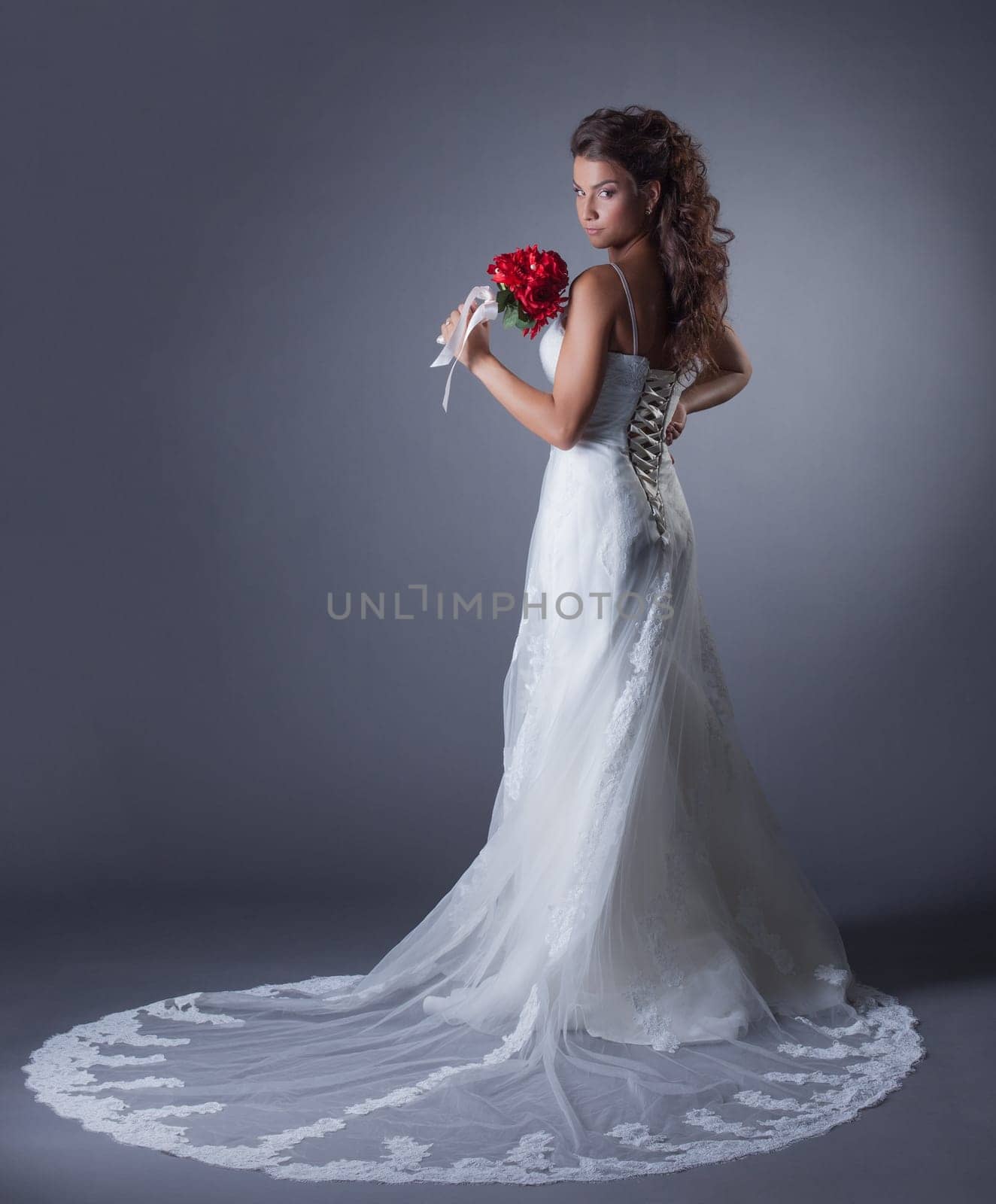 Image of charming bride posing in elegant dress, close-up