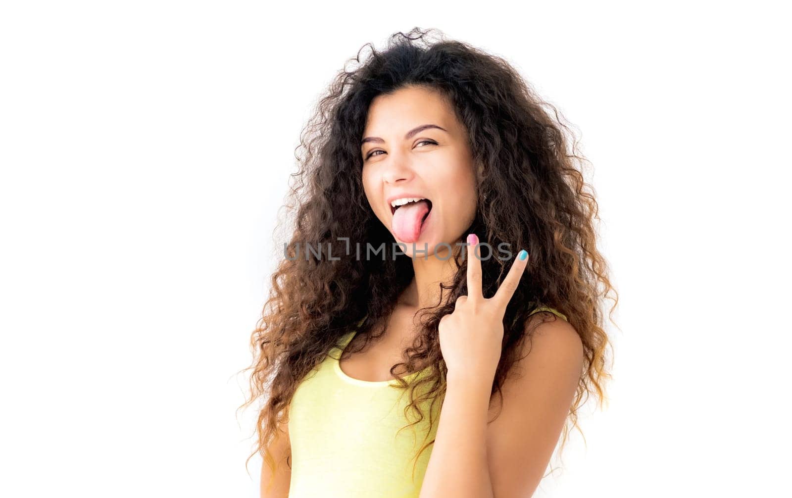 Attractive young girl showing victory gesture