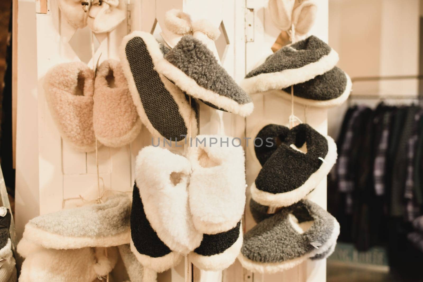 Sheep wool slippers hanging at the store
