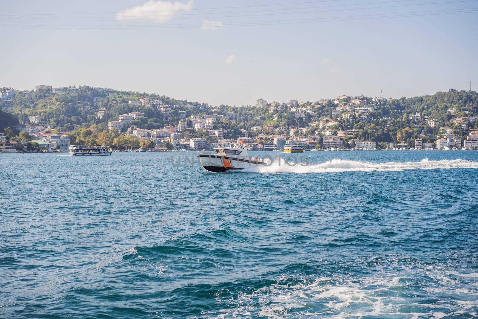 police boat going on the sea and wave behind it, police boat on bosphorus, police chasing criminal at sea, white wave by galitskaya