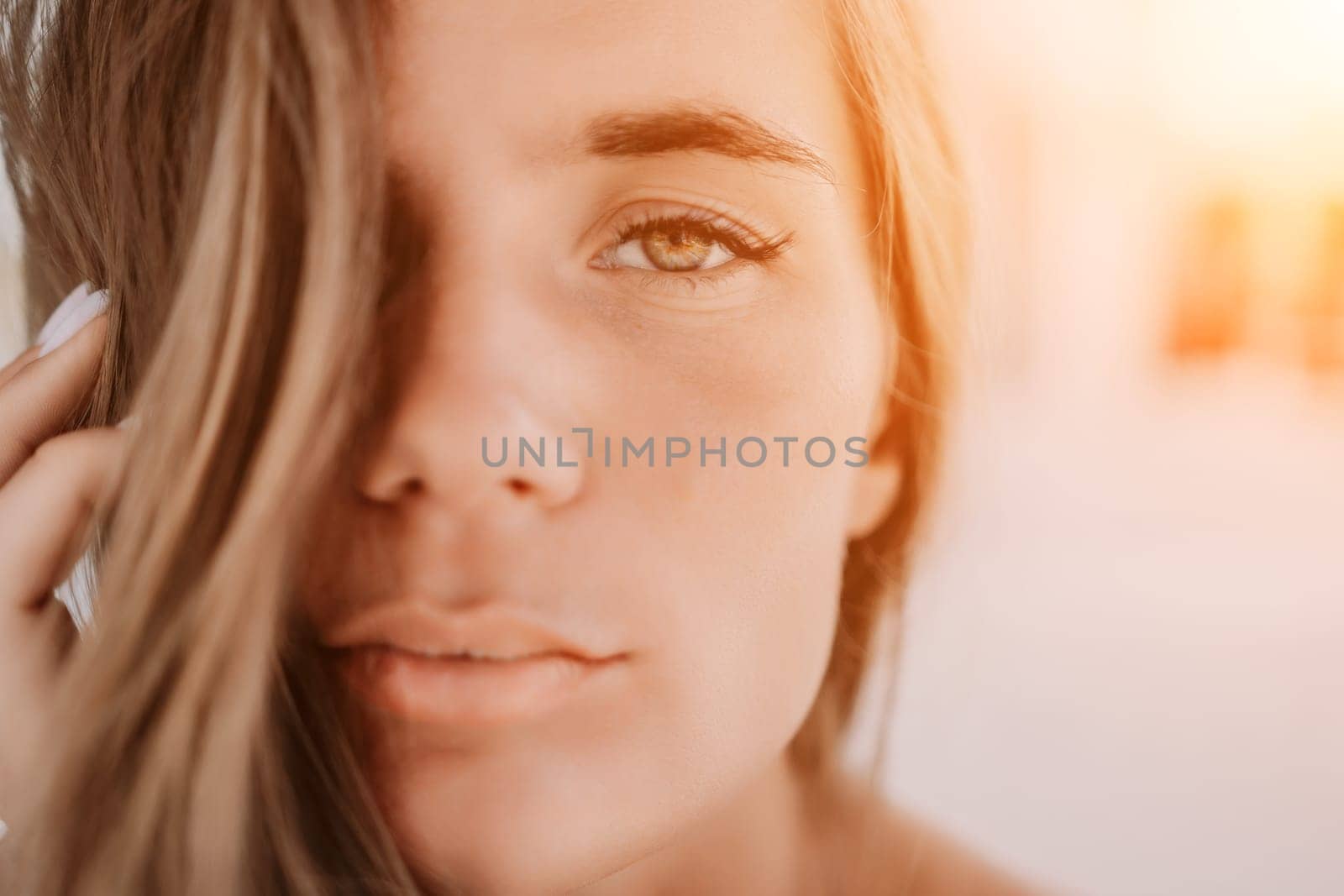 Happy woman portrait in cafe. Boho chic fashion style. Outdoor photo of young happy woman with long hair, sunny weather outdoors sitting in modern cafe