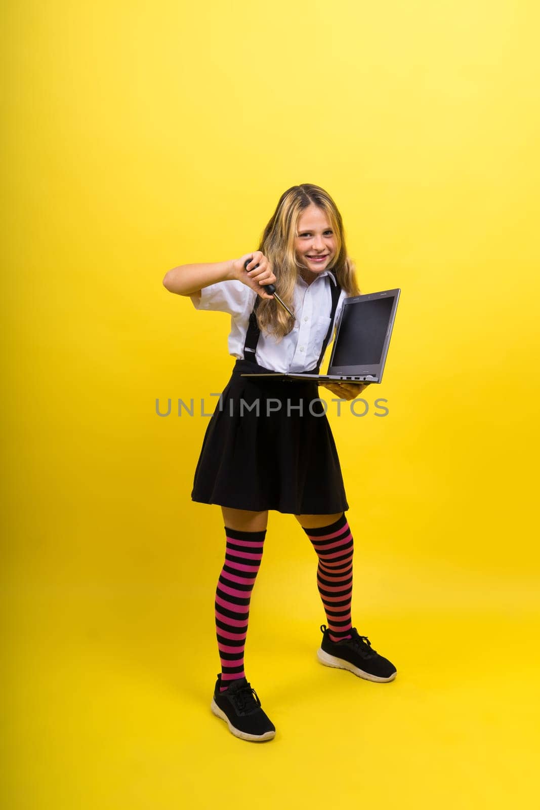 Funny little blonde kid girl 12-13 years old studio portrait. Childhood lifestyle conception