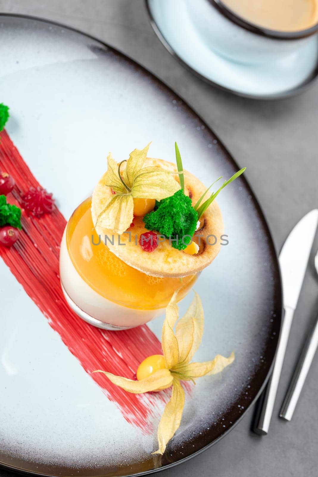 Panna cotta on stone table in fine dining restaurant by Sonat