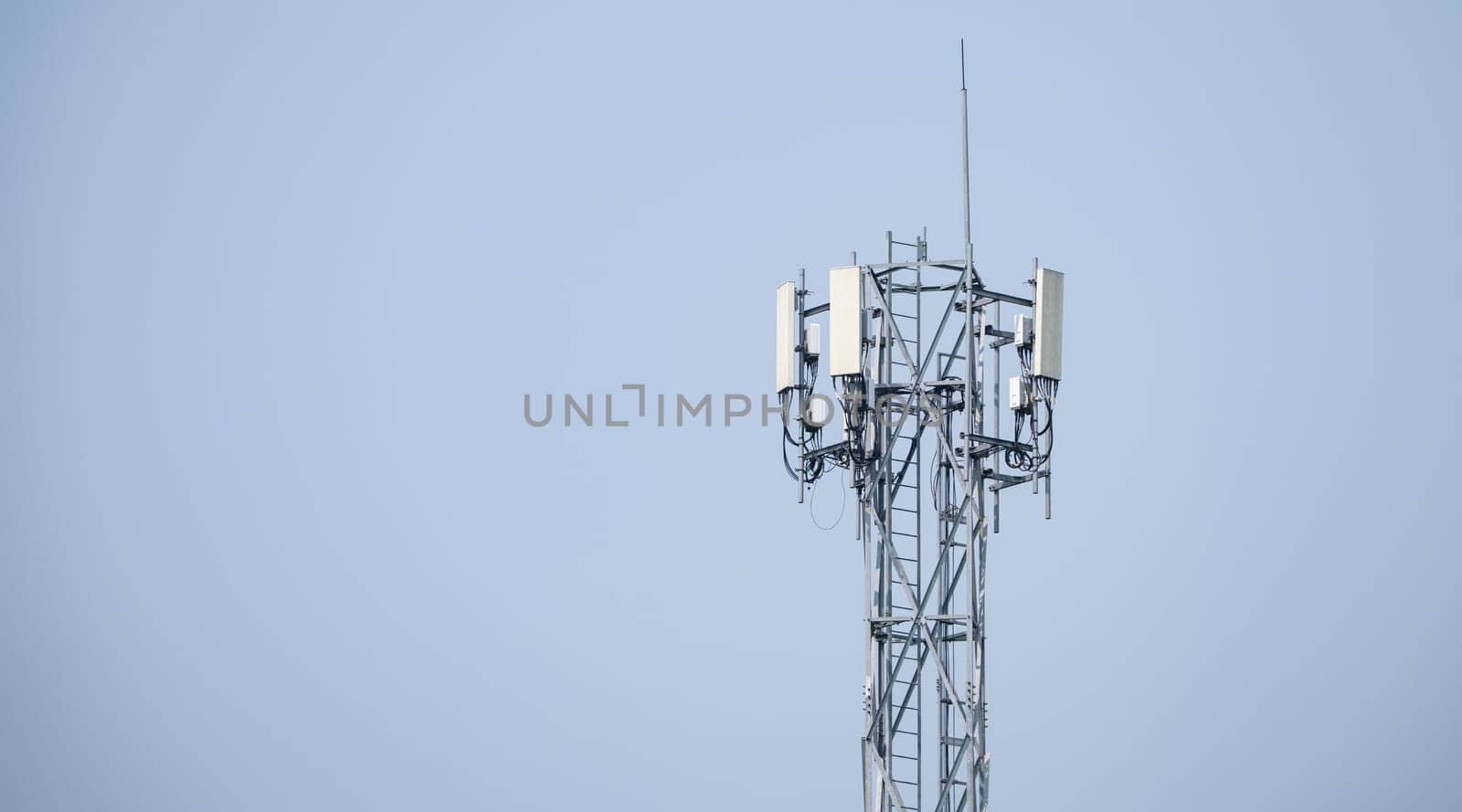 Telecommunication tower. Antenna on gray sky. Radio and satellite pole. Communication technology. Telecommunication industry. Mobile or telecom 5g network. Network connection business background.