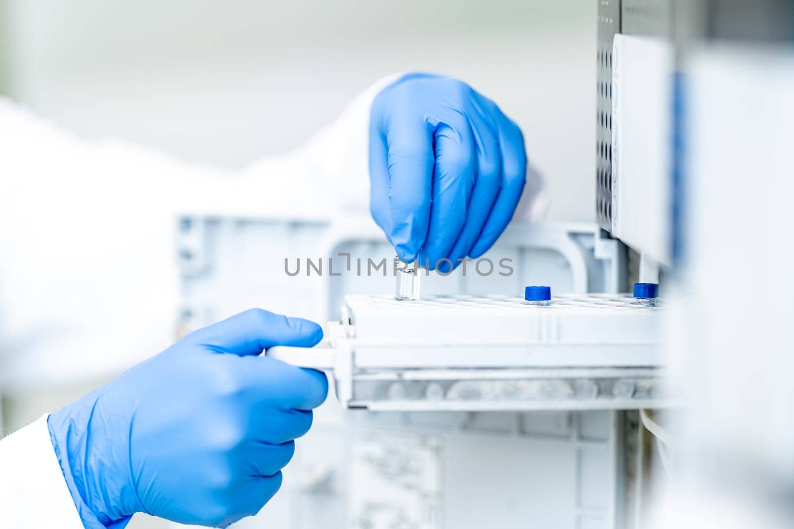 examination of a chemical sample using modern devices in the biochemical laboratory of the research institute. High quality photo