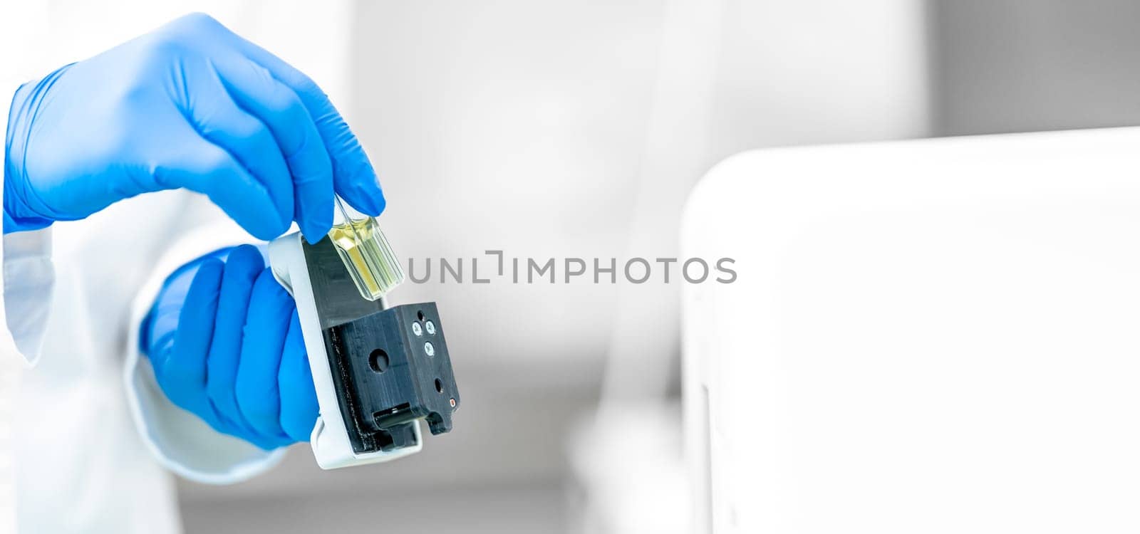 examination of a chemical sample using modern devices in the biochemical laboratory of the research institute. High quality photo