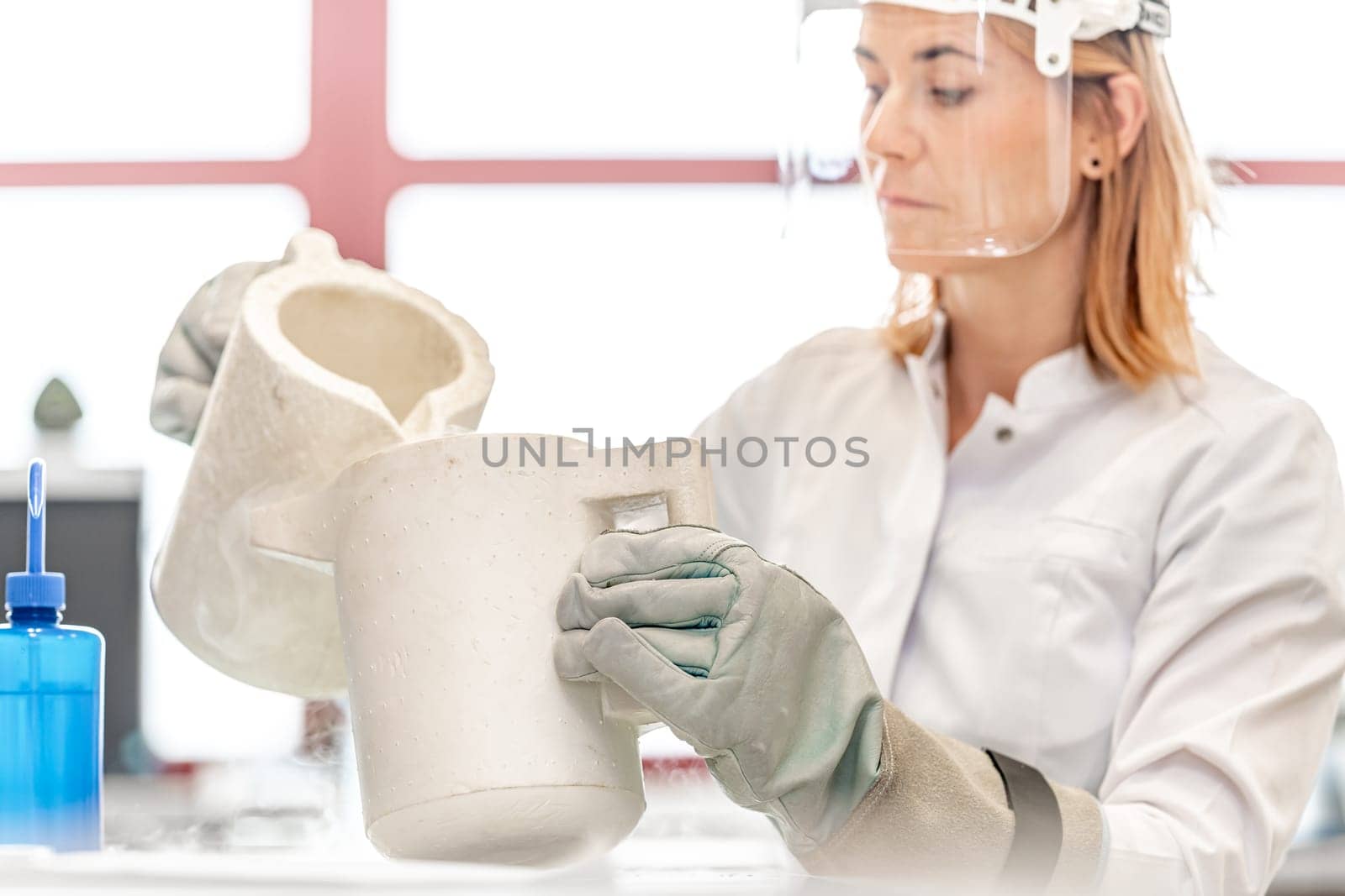 research of dangerous chemical substances in the biochemical laboratory of the Scientific Institute. Use protective equipment, glass face mask and rubber gloves by Edophoto