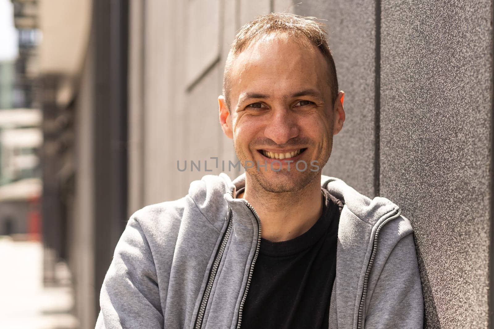 Portrait of happy handsome Hispanic man smiling.