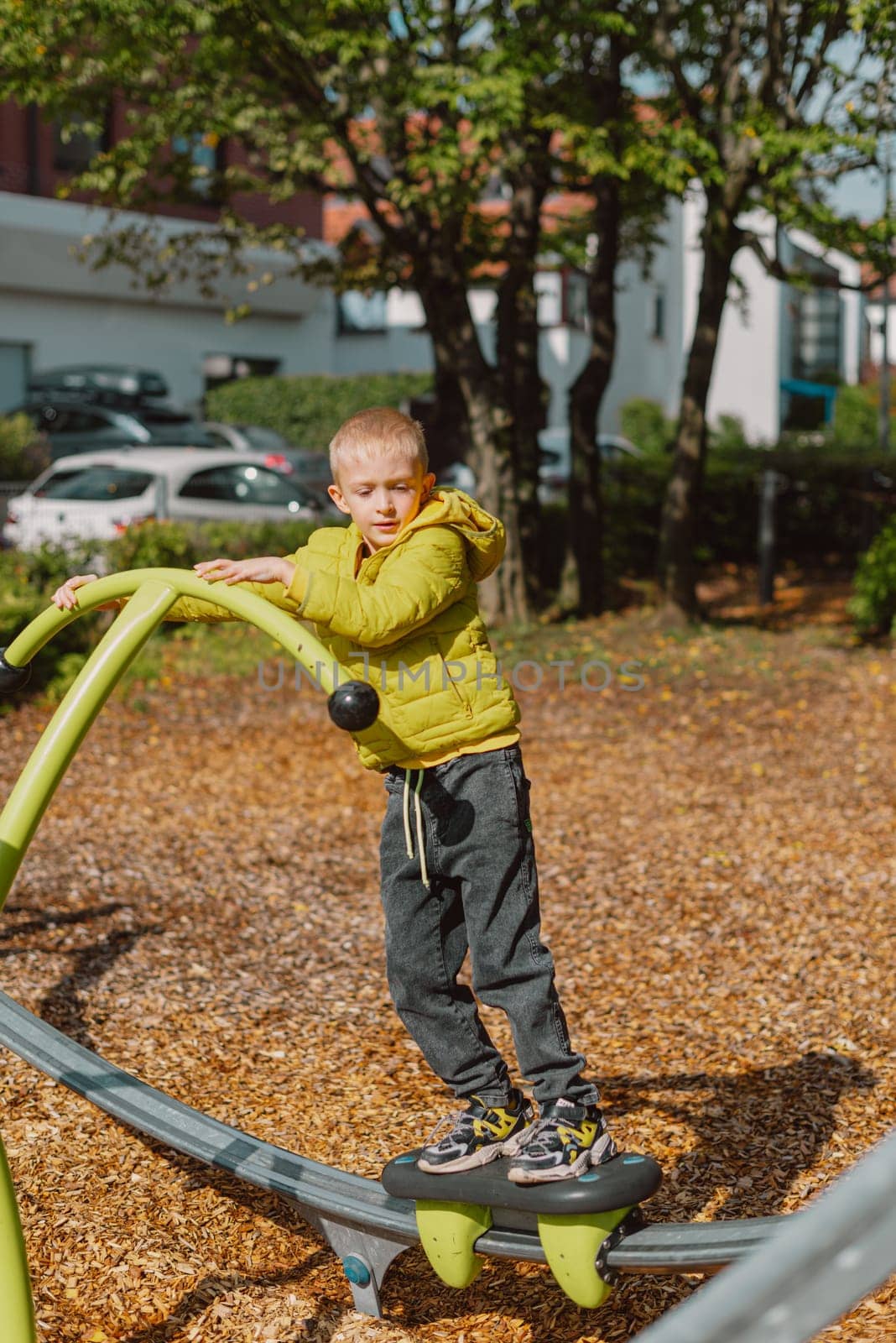 Funny cute happy baby playing on the playground. The emotion of happiness, fun, joy. Smile of a child. boy playing on the playground.