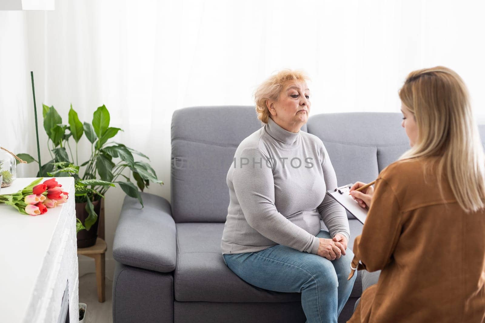 Psychology, depression. Suffering old woman, consulting with psychologist, psychiatrist while patient counseling mental problem. Encouraging, therapy, health care