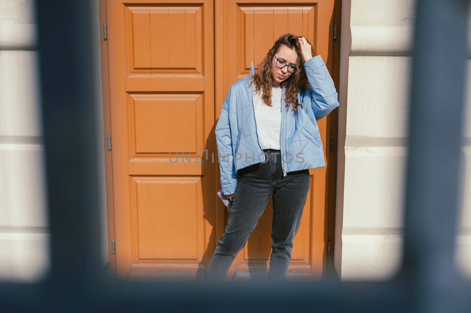 Portrait of a stylish woman in blue jacket. Spring outdoor portrait.
