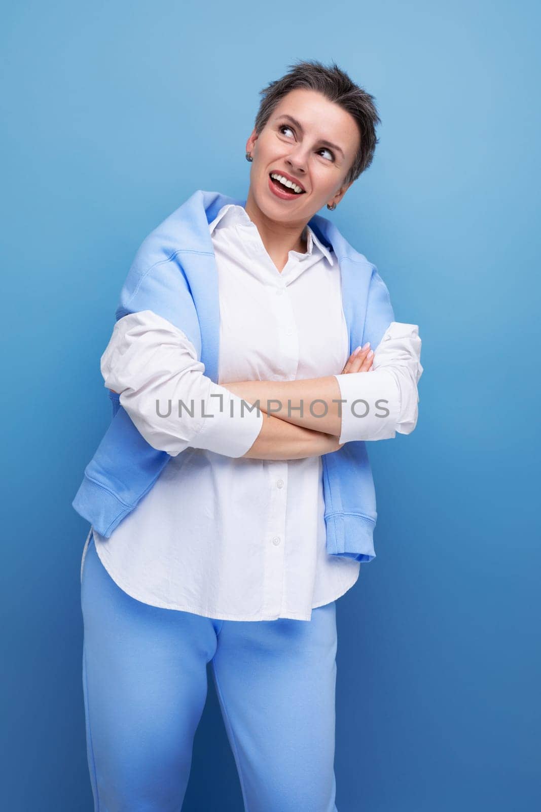 dreamy brunette short haired young woman in casual look by TRMK