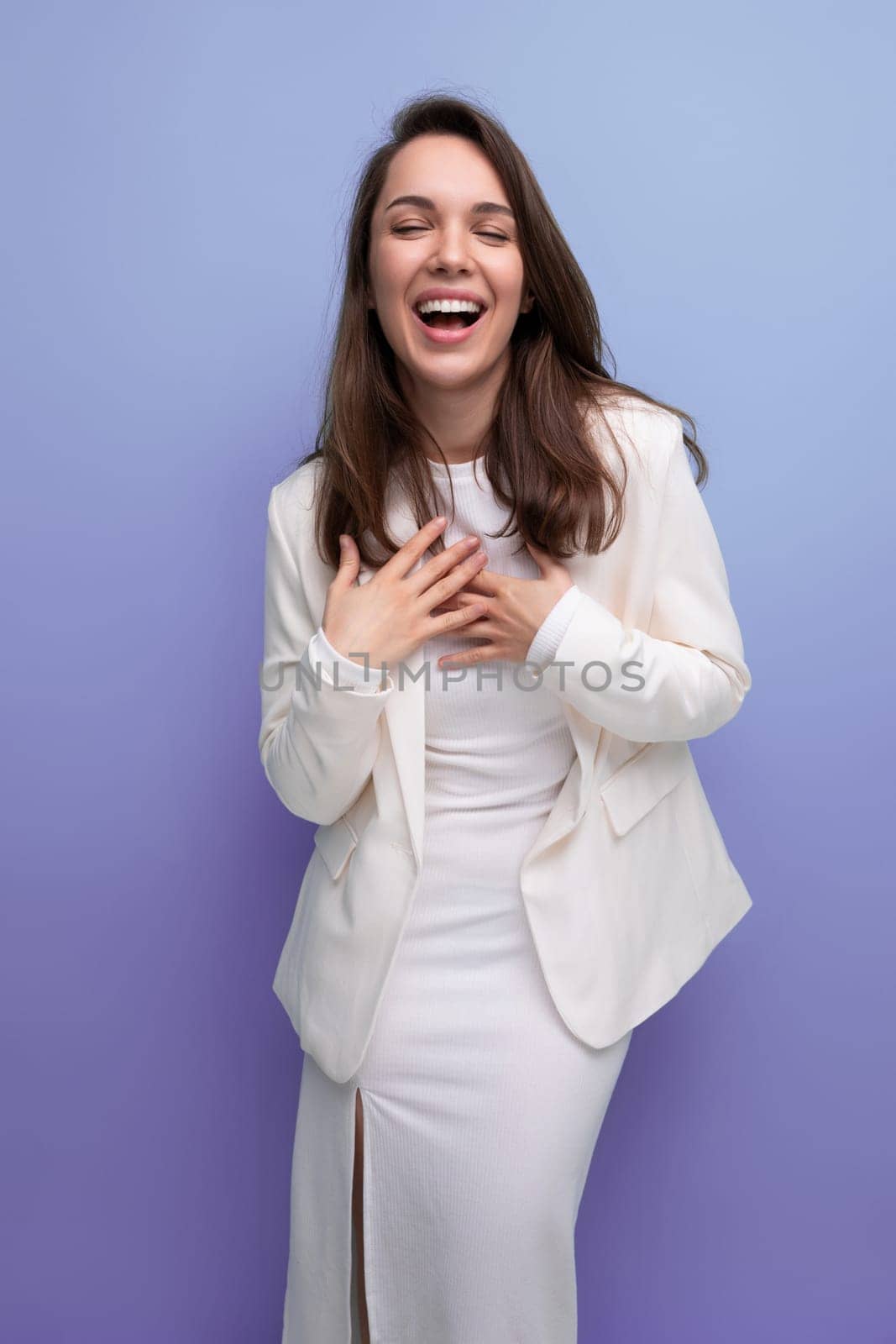 pretty dark-haired lady in a white dress and jacket.