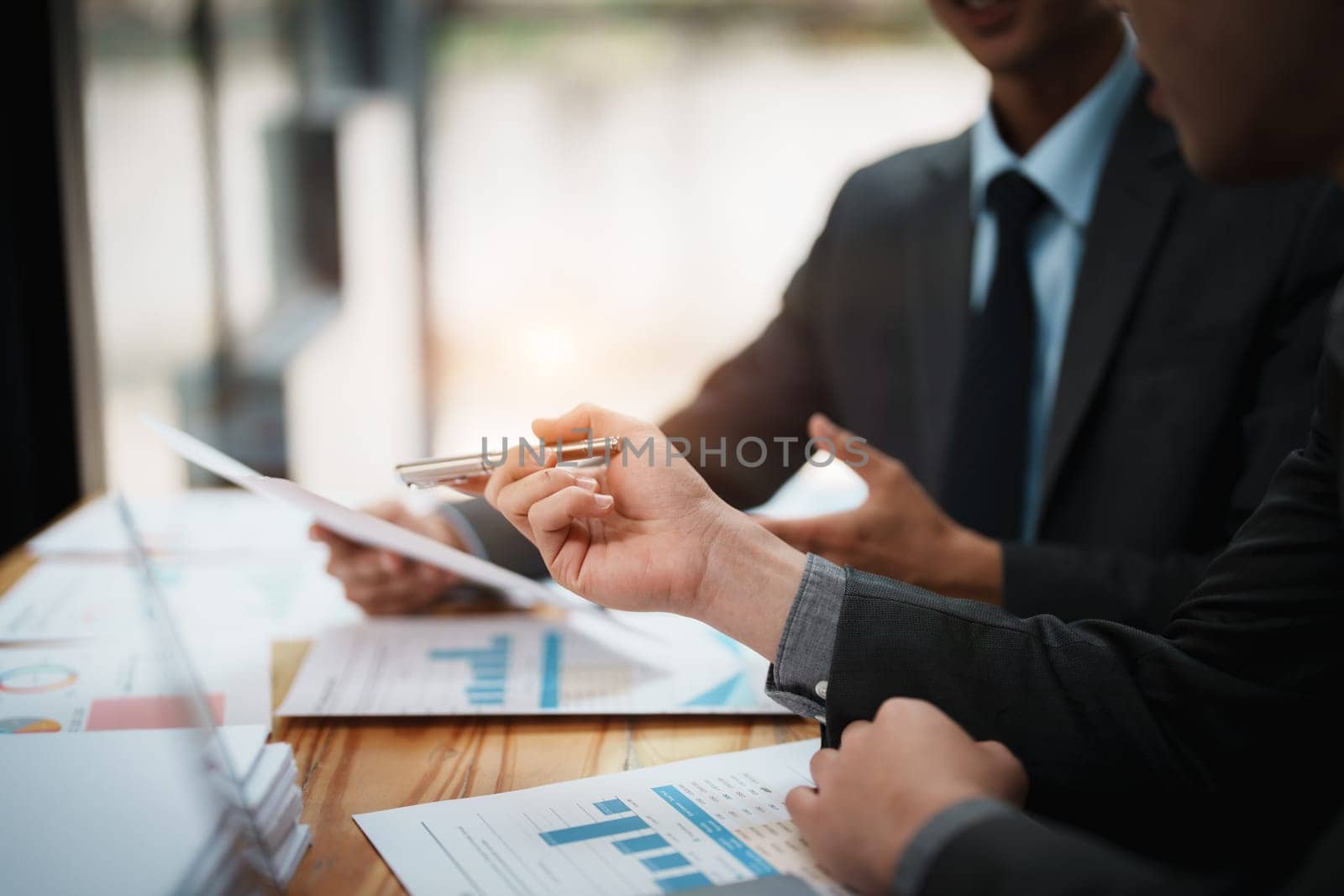 Asian business advisor meeting to analyze and discuss the situation on the financial report in the meeting room.Investment Consultant, Financial , teamwork ,brainstorming ,startup and accounting.