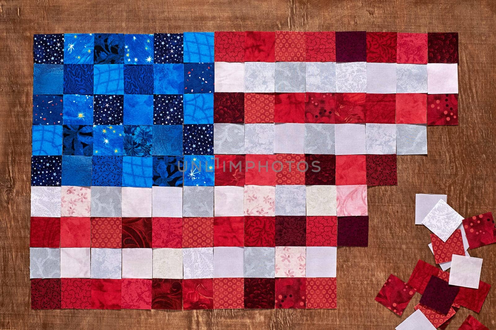 Square pieces of fabrics lying like a flag of USA