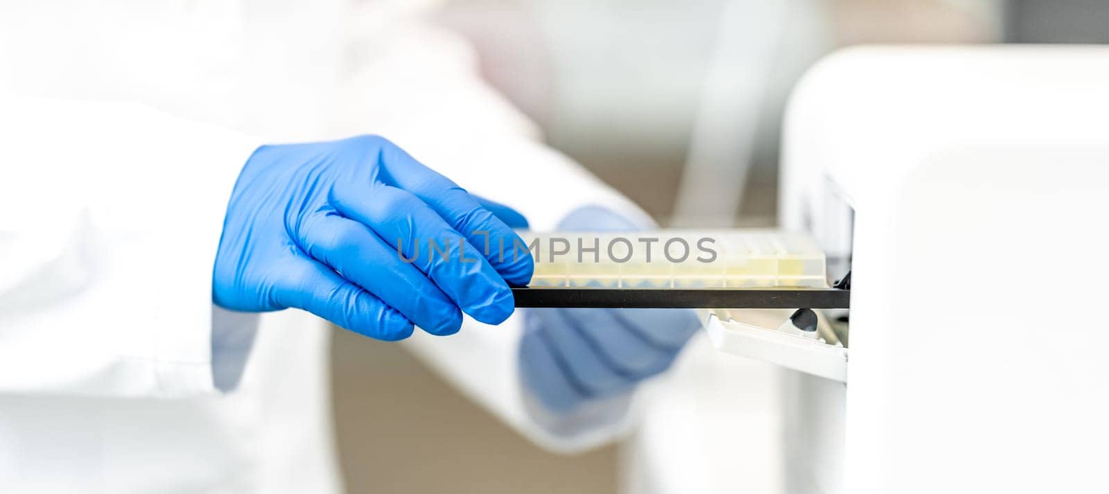 examination of a chemical sample using modern devices in the biochemical laboratory of the research institute. High quality photo
