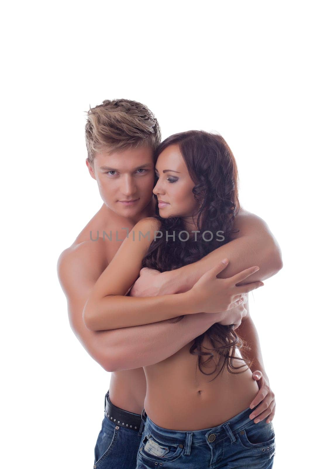 Portrait of excited young lovers posing in studio, close-up