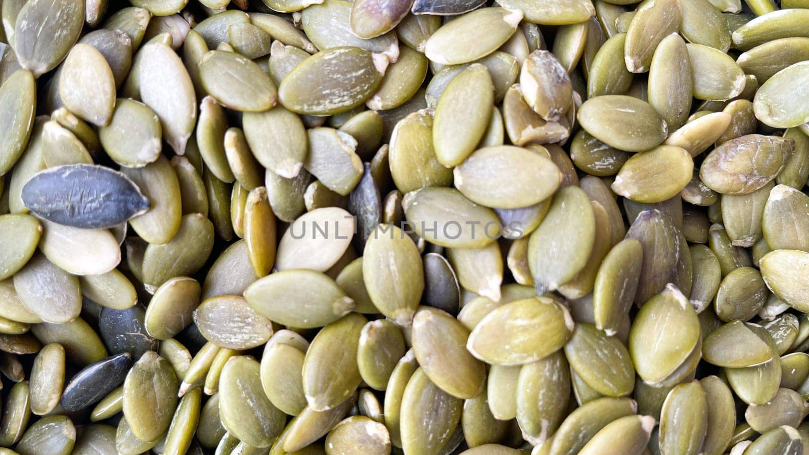 peeled green pumpkin seeds filled texture