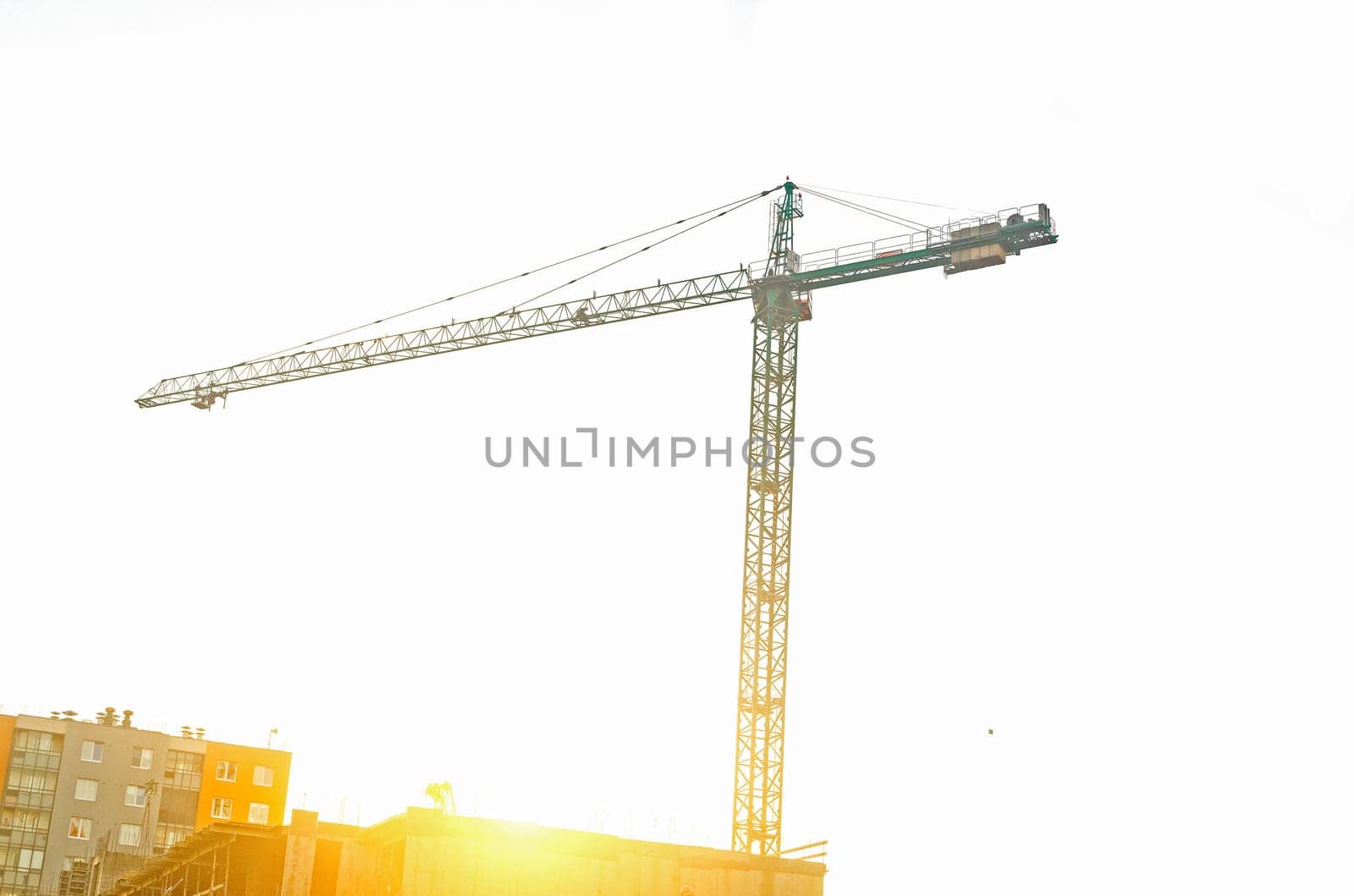 Construction crane,on sunset.Construction site.