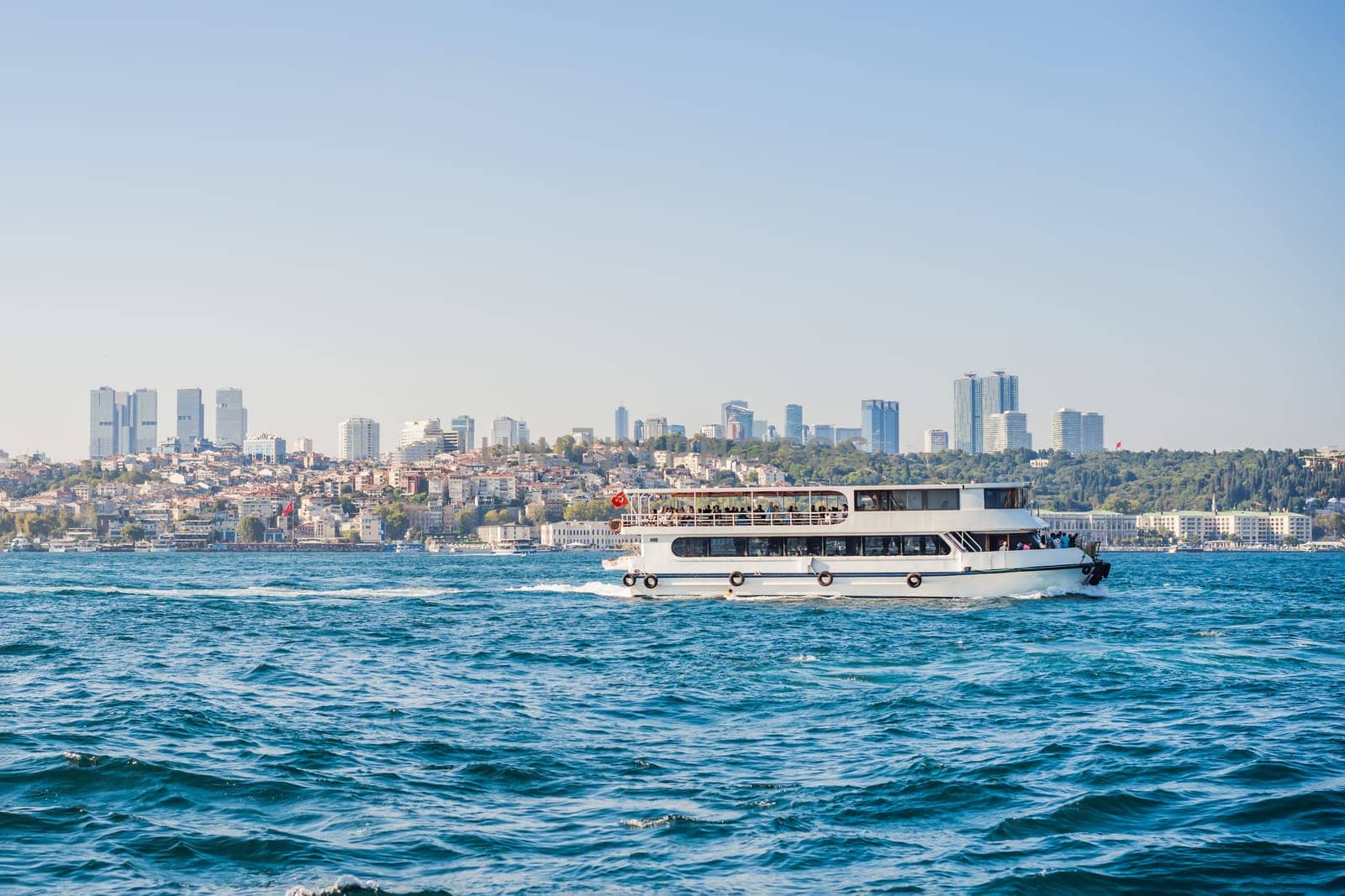 Muslim architecture and water transport in Turkey - Beautiful View touristic landmarks from sea voyage on Bosphorus.