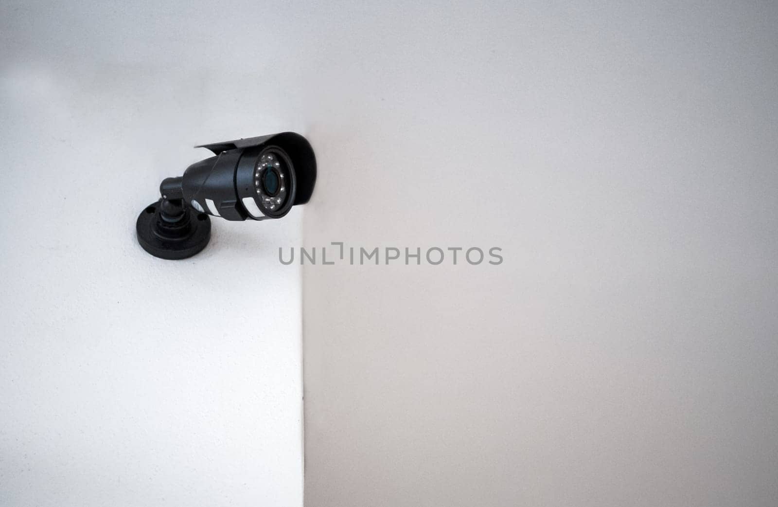 CCTV cameras installed on a white wall. Concept of surveillance and monitoring.