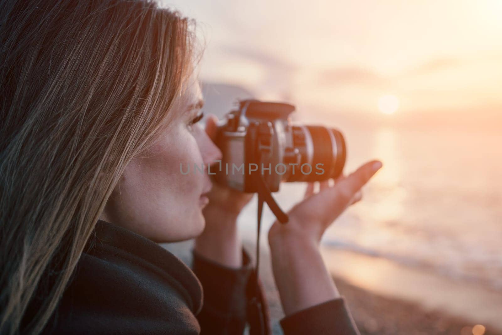 Woman travel sea. Happy tourist enjoy taking picture outdoors for memories. Woman traveler looks at sea bay of mountains, sharing travel adventure journey by panophotograph