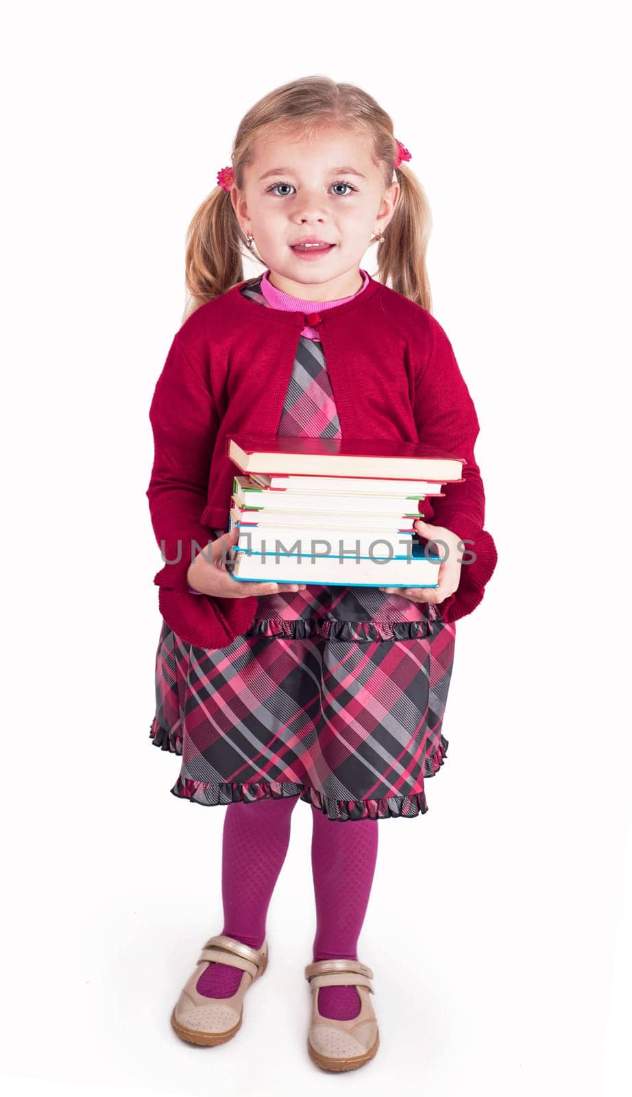 Education concept. An inquisitive child. Little girl with books getting ready to go back to school by aprilphoto