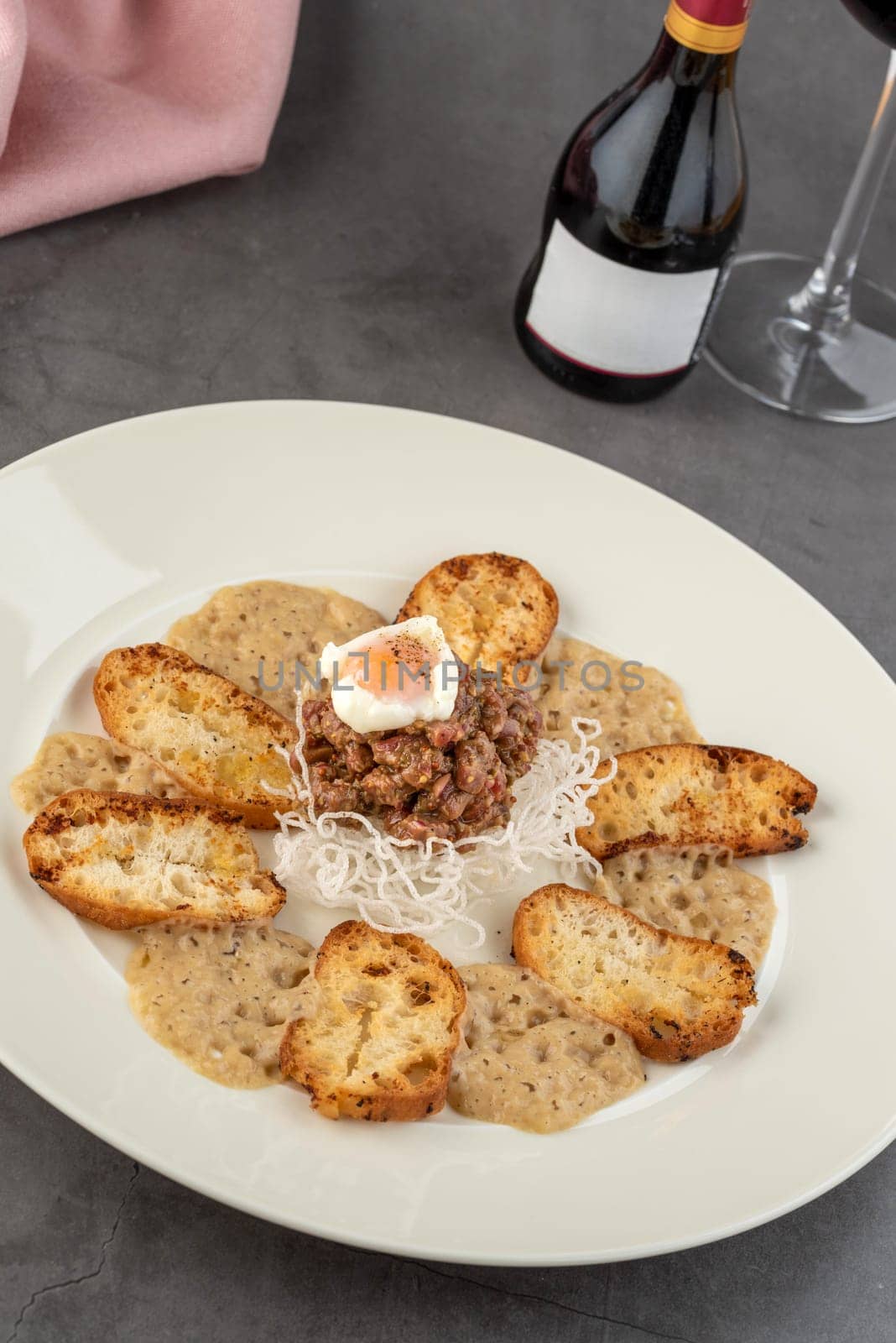 Veal tartare on stone table in fine dining restaurant by Sonat