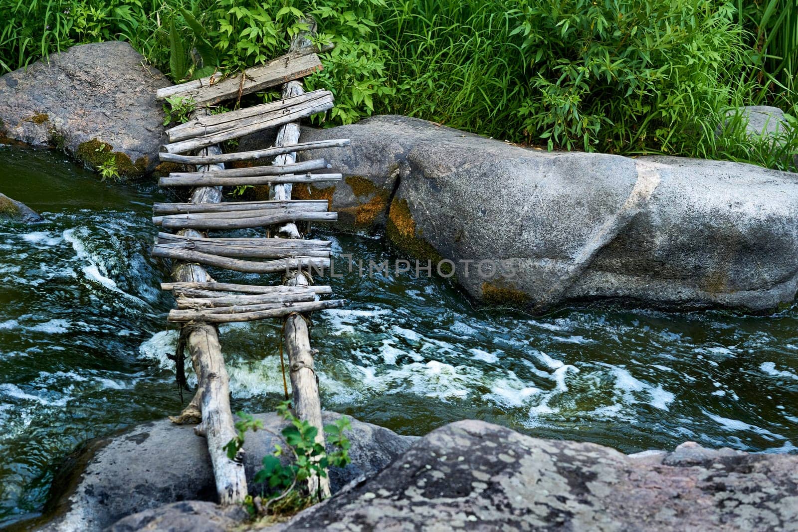 a structure carrying a road, path, railroad, or canal across a river, ravine, road, railroad, or other obstacle