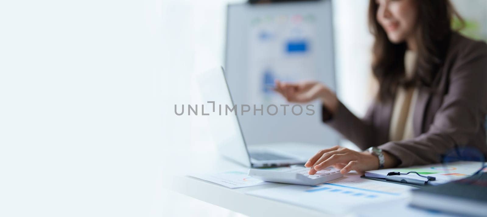 Beautiful young teen asian business woman meeting at on computer laptop with planning working on financial document, tax, exchange, accounting and Financial advisor