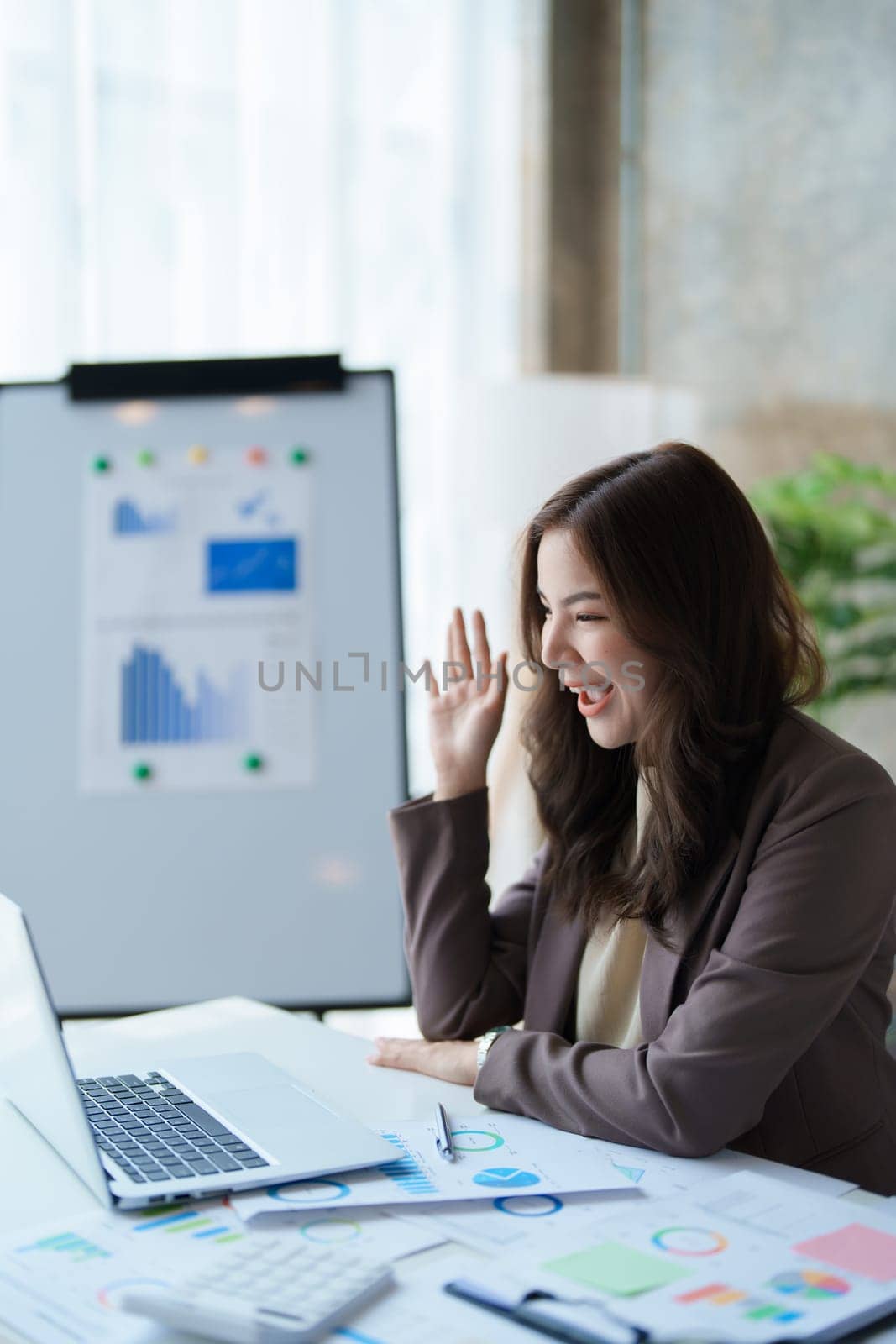 Beautiful young teen asian business woman meeting at on computer laptop with planning working on financial document, tax, exchange, accounting and Financial advisor.