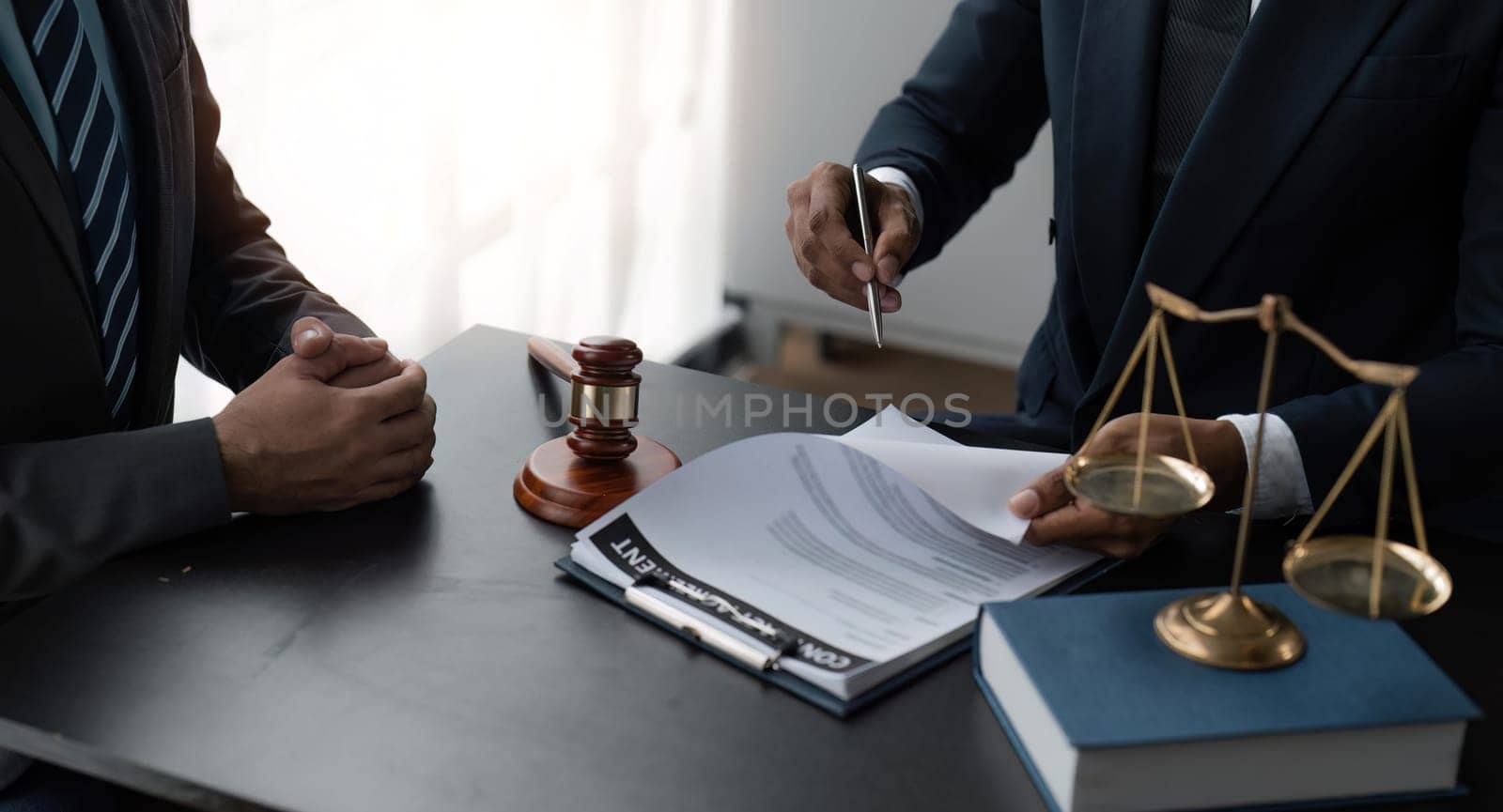 Consultation and conference of Male lawyers and businesswoman working and discussion having at law firm.