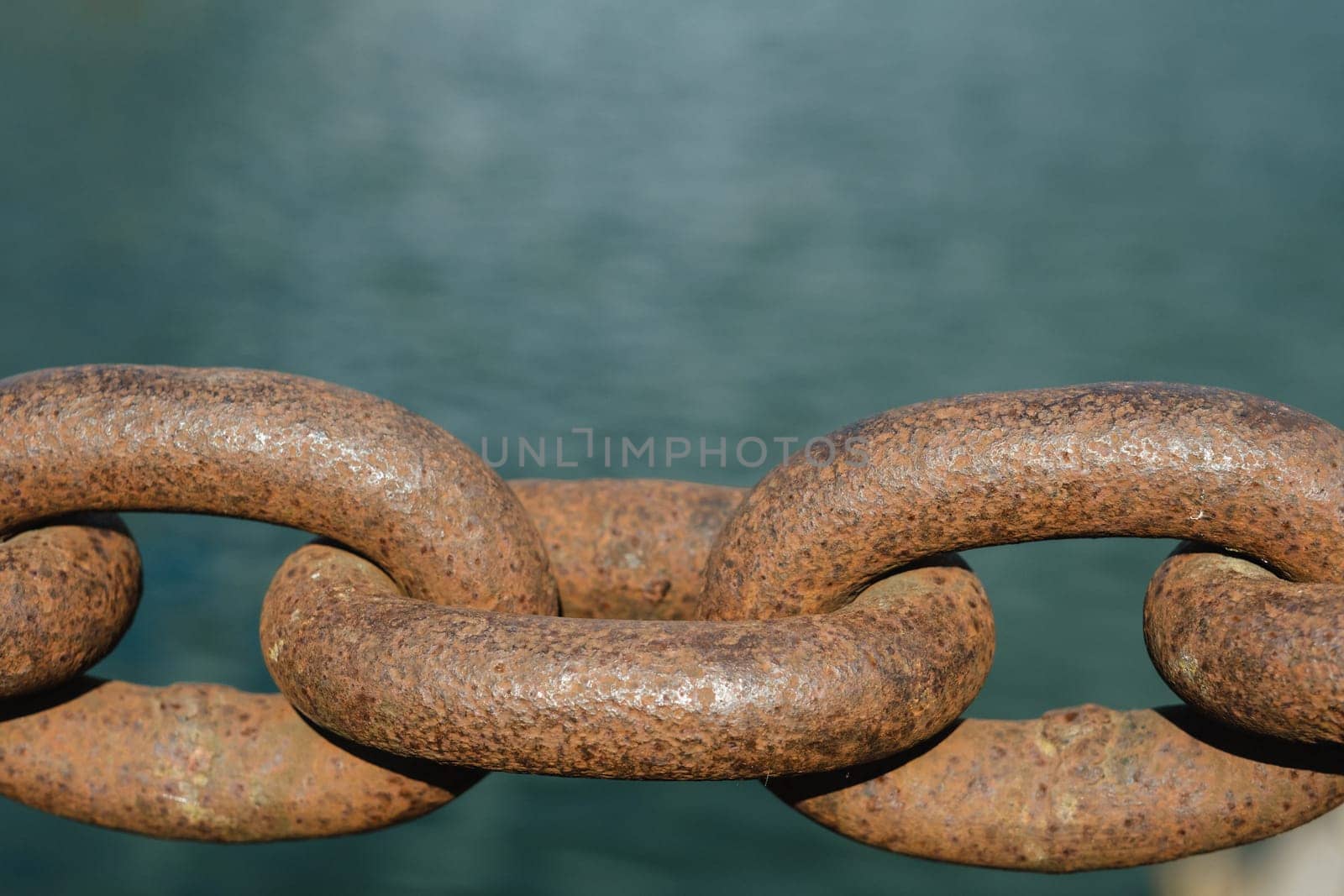 Old rusty metal chain outdoors. Large chain links.