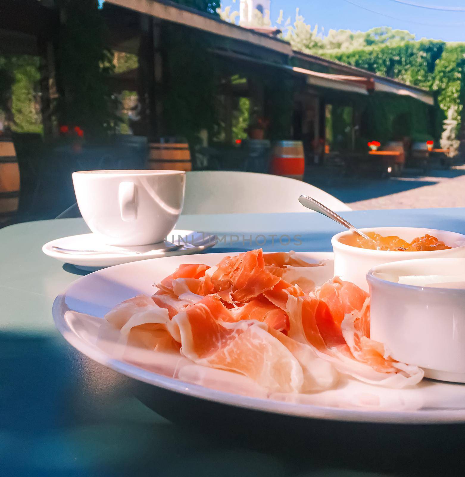 Breakfast outdoors in summer, ham, jam, butter and ham.