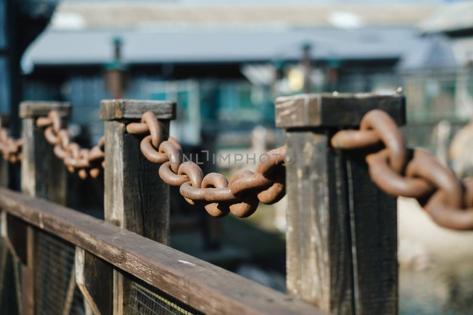 Old rusty metal chain outdoors. Large chain links.